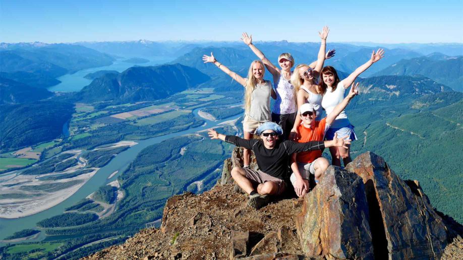 successful group happy friends on mountain 918x516 1